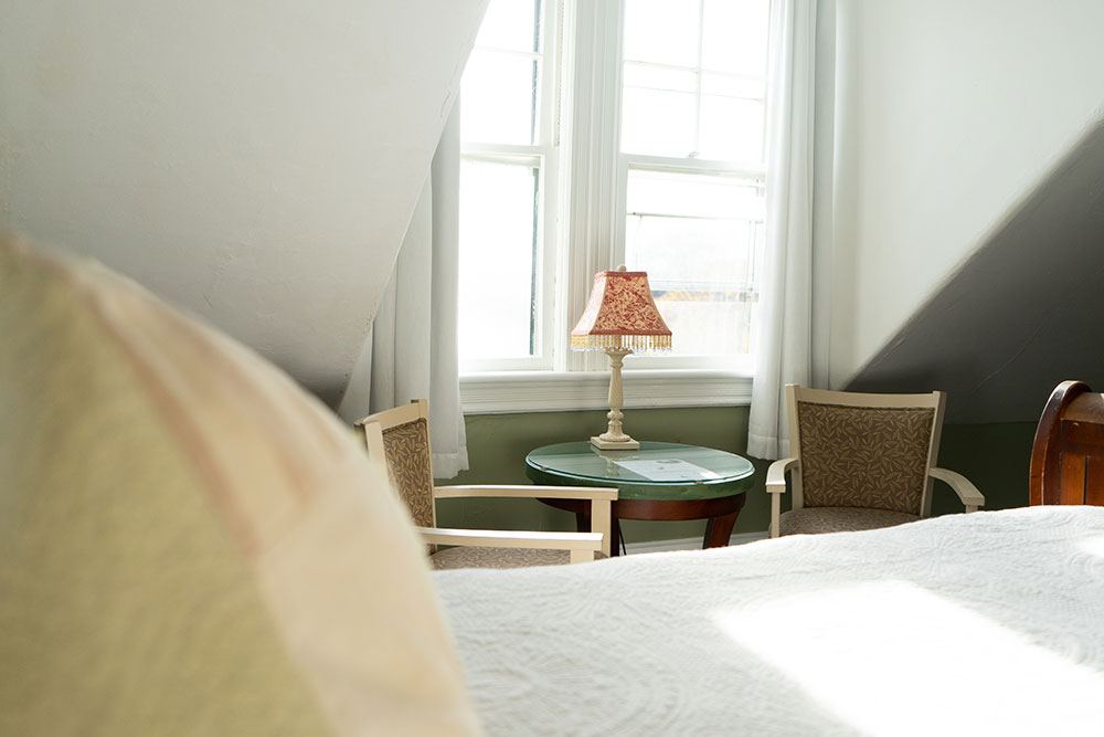 Sleigh Room sitting corner by the dormer window with two wooden armchairs
